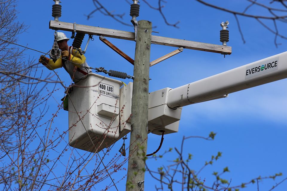An Eversource lineworker fixes transmission lines 